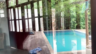 My neighbors are taking a shower on the patio. I must go there to see it up close