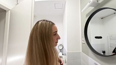 Amazingly beautiful college girl in the bathroom with a super skirt miniskirt shows her ass