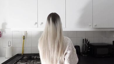 Amazingly beautiful petite blonde hot college girl in her dormitory kitchen getting ready for Christmas Party