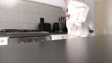 Amazingly beautiful petite blonde hot college girl in her dormitory kitchen getting ready for Christmas Party