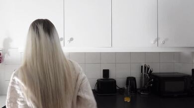 Amazingly beautiful petite blonde hot college girl in her dormitory kitchen getting ready for Christmas Party