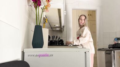 Amazingly beautiful petite blonde hot college girl in her dormitory kitchen getting ready for Christmas Party