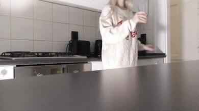 Amazingly beautiful petite blonde hot college girl in her dormitory kitchen getting ready for Christmas Party