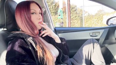 Artemisia Love smoking with her tits out in the car