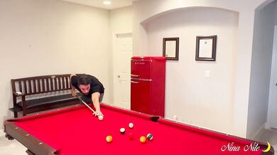 Nina enjoys some pool table fun