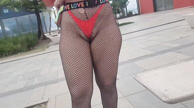 Wife showing off in a micro bikini in the street.