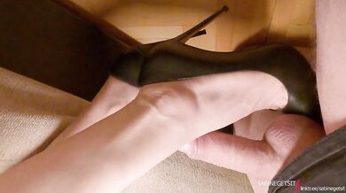 MILF shoe job in black high heels and leather skirt