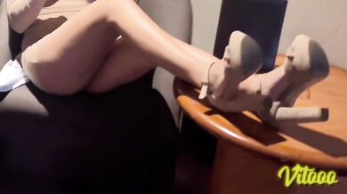 Latina with black hair playing with a cock