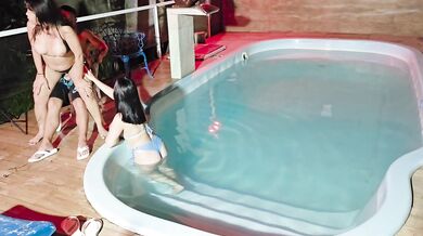 Caught in the act! Two brunettes caught masturbating in the pool