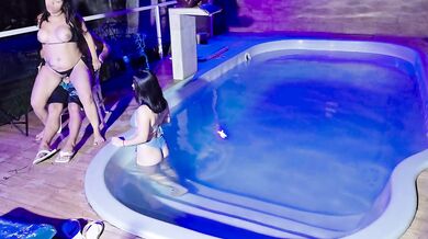 Caught in the act! Two brunettes caught masturbating in the pool