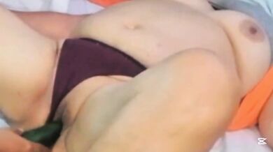 Mature milf likes to have cucumber stuffed in her tight pussy
