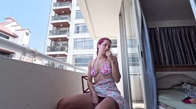 BALCONY EXHIBITIONIST! Petite redhead spreading her legs for a toy session outdoors