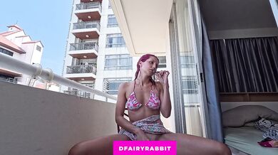 BALCONY EXHIBITIONIST! Petite redhead spreading her legs for a toy session outdoors