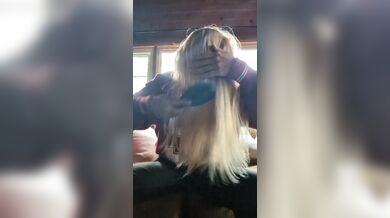 Brushing Hair In Living Space