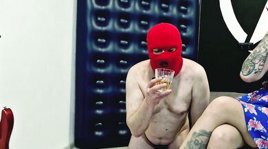 Dominatrix Nika ties the slave's balls with a rope, puts her panties on his face, pees in a glass and gives the slave her golden juice to drink.