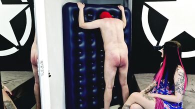 Slave punishment. Spanking of the bare ass, flogging. BDSM punishment until the slave's ass turns red.