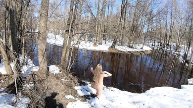 Naked girl in a winter village