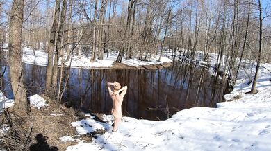 Naked girl in a winter village