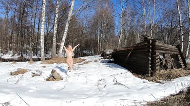 Naked girl in a winter village