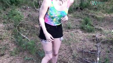 Babe in woods flashes her tits!