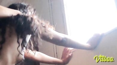 Latina with black hair shakes her ass while standing