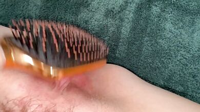I can't get enough of the creamy insertion of my hairbrush into my pussy