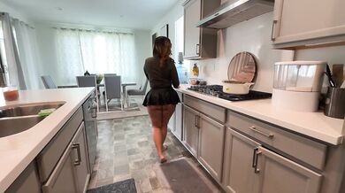 Stepmom cleaning up in the kitchen