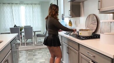 Stepmom cleaning up in the kitchen