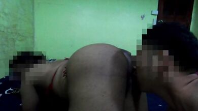 A plump woman in a red G-string. Worth catching a pussy her.