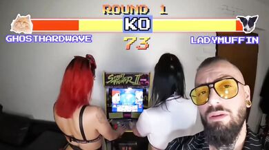 Two young women play video games and then have strapon sex