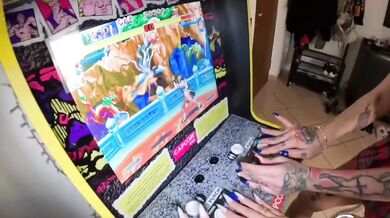 Two young women play video games and then have strapon sex