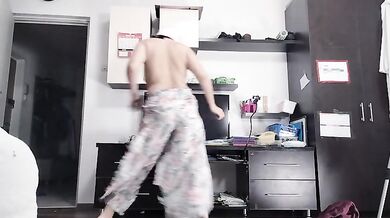 Amateur woman has fun trying on clothes and cutting them