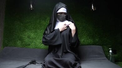 Filthy nun masturbating in her cell — fisting her cunt and squirting hard while she shakes in orgasm.