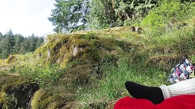 Milf dildo fucks herself beside public waterfalls