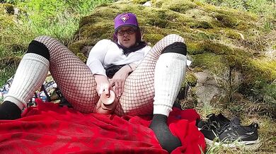 Milf dildo fucks herself beside public waterfalls