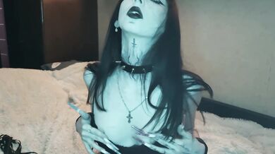 Goth pixie in fishnet stockings having fun with magic whip
