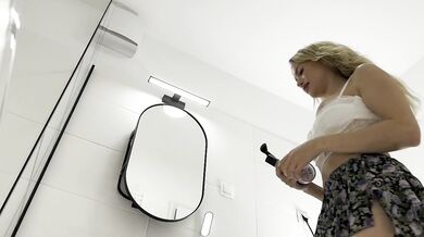 Blonde bombshell in tennis skirt shows off huge tits no panties in bathroom solo