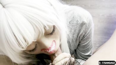 White-haired girl deepthroats a china doll in uniform