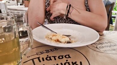 Fingering in a crowded restaurant showing leaking pussy and tits under her dress