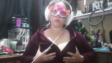 Latina milf plays with her big tits at work masked and gagging for more