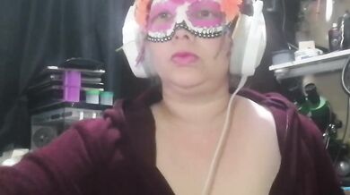 Latina milf plays with her big tits at work masked and gagging for more