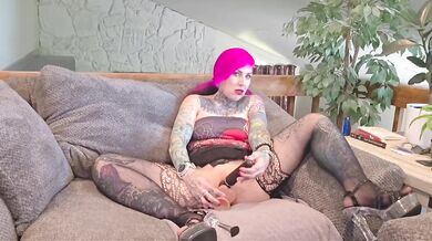 Pink haired tattooed MILF gets her tits sucked while she masturbates hard