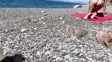 Oiled exhibitionist gets caught nude on public beach