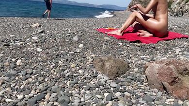 Oiled exhibitionist gets caught nude on public beach