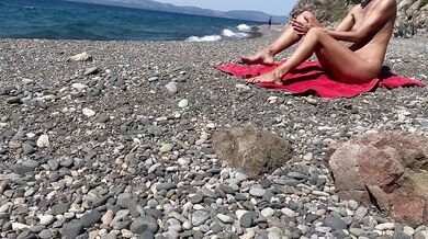 Oiled exhibitionist gets caught nude on public beach
