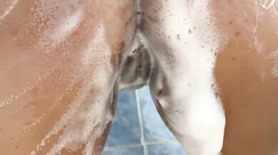Pretty Eva strokes her pussy in the shower messy shower action
