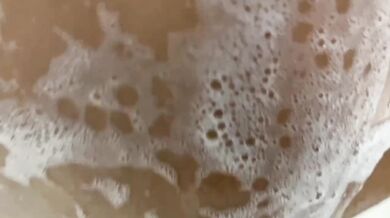 Pretty Eva strokes her pussy in the shower messy shower action