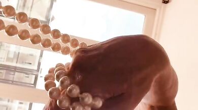 KatyTheMilf 7mm piercings strutting in latex corset on balcony in red heels