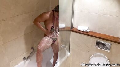 Soapy MILF flexes in tiny bikini until dripping wet and ruined