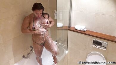 Soapy MILF flexes in tiny bikini until dripping wet and ruined